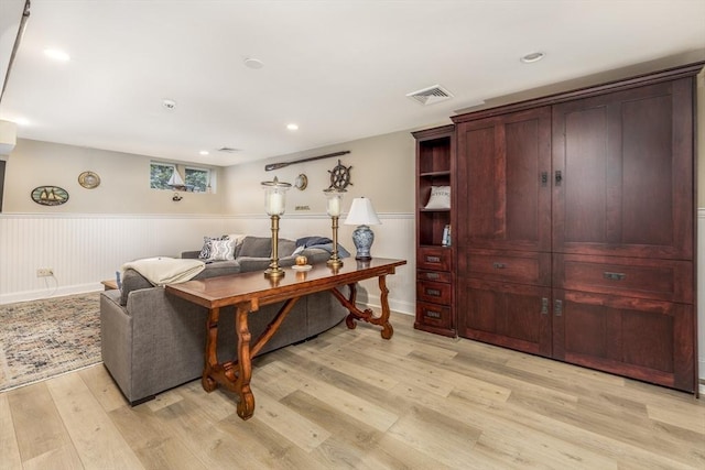 living room with light hardwood / wood-style flooring