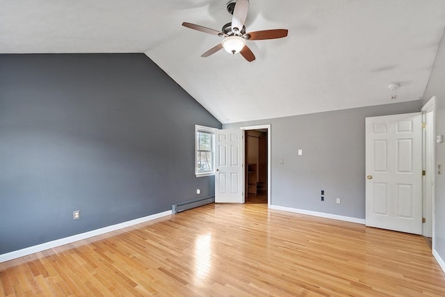 interior space featuring light wood-style flooring, baseboard heating, ceiling fan, baseboards, and high vaulted ceiling