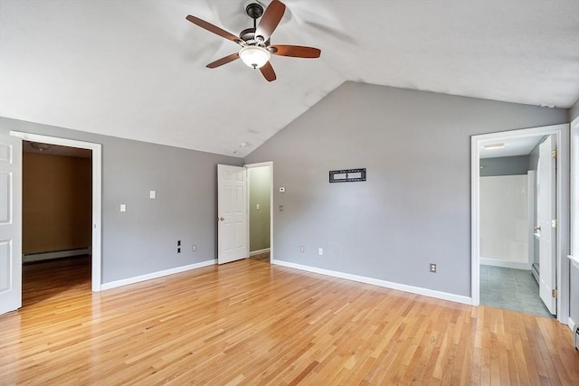 unfurnished bedroom with baseboard heating, ceiling fan, light wood finished floors, baseboards, and lofted ceiling