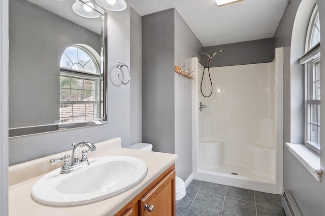 bathroom with baseboard heating, walk in shower, toilet, and tile patterned flooring