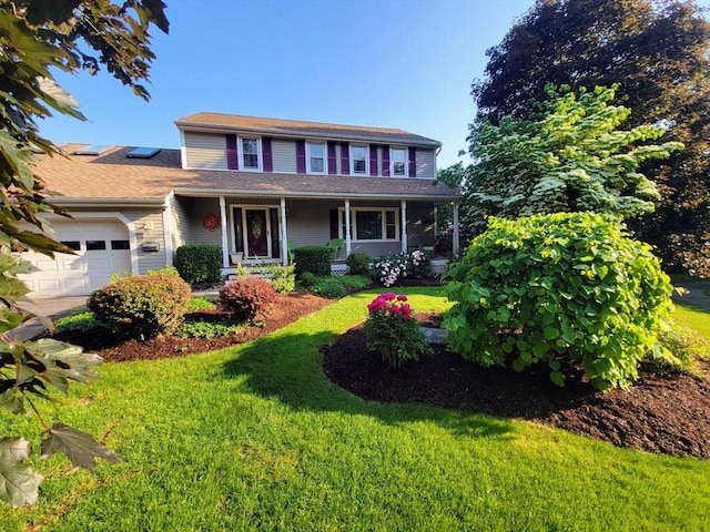 30 Ridgewood Ln, Quincy, MA 02169 - view of front of home featuring an attached garage, a porch, and a front lawn