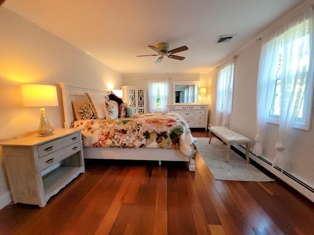 30 Ridgewood Ln, Quincy, MA 02169 - bedroom with baseboard heating, dark wood-style flooring, and a ceiling fan