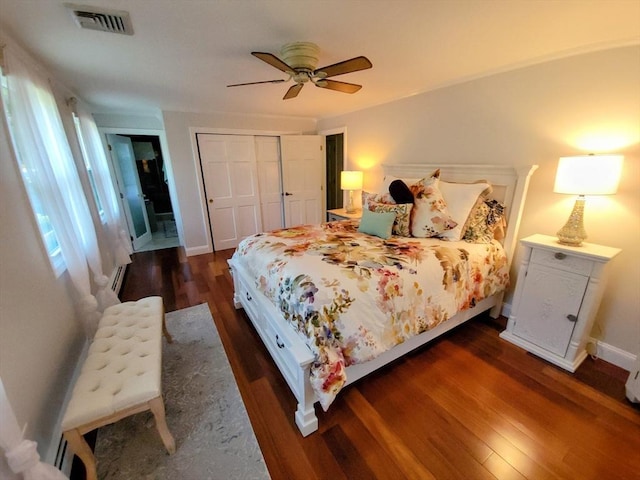 30 Ridgewood Ln, Quincy, MA 02169 - bedroom with dark wood-style floors, a closet, and a ceiling fan