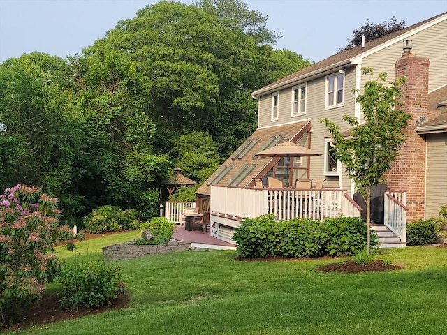 30 Ridgewood Ln, Quincy, MA 02169 - back of property featuring a lawn and a deck