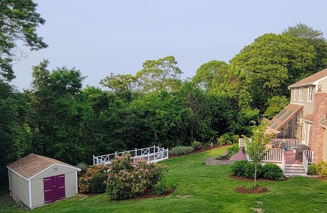 30 Ridgewood Ln, Quincy, MA 02169 - view of green lawn featuring a storage unit and a wooden deck
