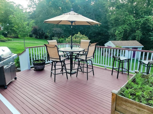 30 Ridgewood Ln, Quincy, MA 02169 - deck with outdoor dining space, area for grilling, a yard, an outbuilding, and view of scattered trees