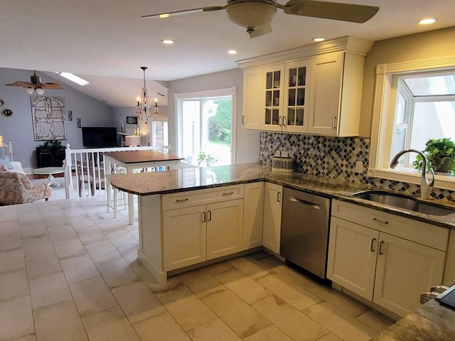 30 Ridgewood Ln, Quincy, MA 02169 - kitchen featuring stainless steel dishwasher, ceiling fan, open floor plan, a peninsula, and backsplash