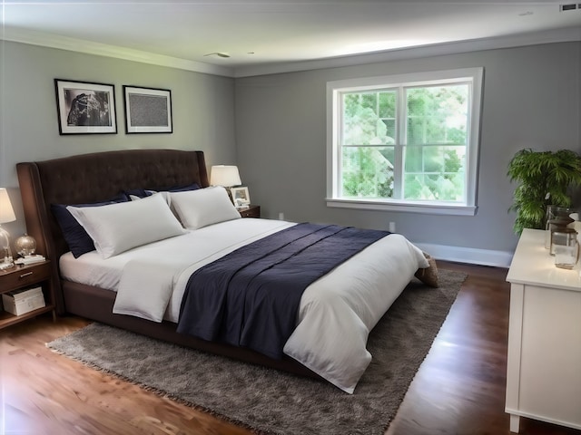 bedroom featuring dark hardwood / wood-style floors and ornamental molding