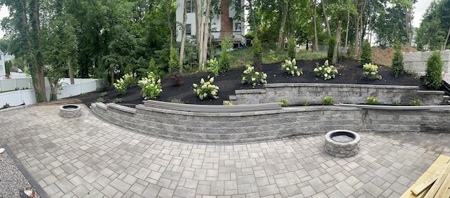 view of patio with a fire pit