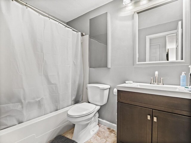 382 Great Rd Unit B103, Acton, MA 01720 - full bath with vanity, toilet, shower / tub combo with curtain, and baseboards