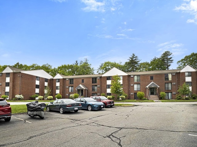 382 Great Rd Unit B103, Acton, MA 01720 - view of apartment building / complex featuring uncovered parking