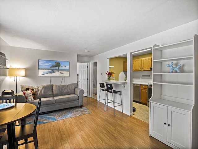 382 Great Rd Unit B103, Acton, MA 01720 - living area with light wood-style flooring