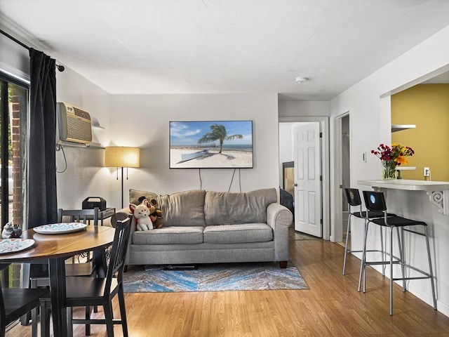 382 Great Rd Unit B103, Acton, MA 01720 - living room featuring wood finished floors and a wall mounted AC