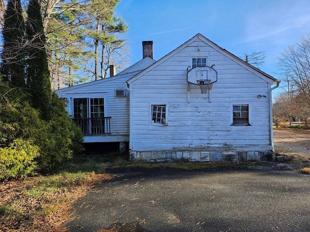 view of home's exterior with a chimney