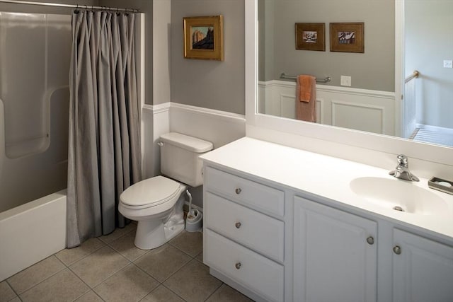 full bath with toilet, shower / tub combo with curtain, vanity, and tile patterned floors
