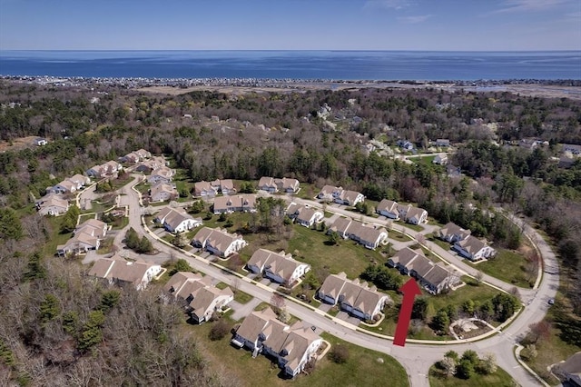 bird's eye view featuring a water view and a residential view
