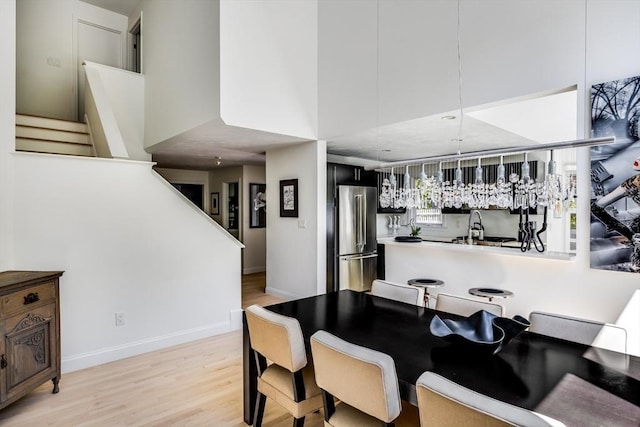 23 Matt Hoxie Trl Unit 23, Plymouth, MA 02360 - dining area featuring light wood finished floors, stairway, and baseboards