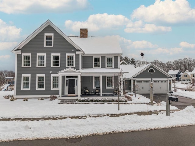 view of front of property featuring a garage and a porch