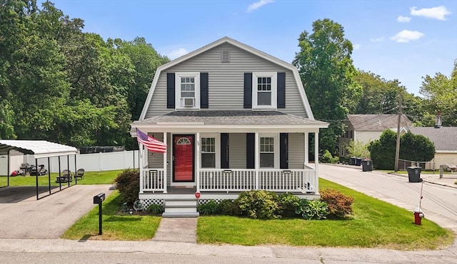 39 Doyle Ave, Dracut, MA 01826 - colonial inspired home featuring covered porch, a carport, a gambrel roof, and asphalt driveway