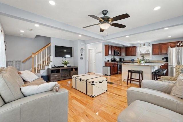 39 Doyle Ave, Dracut, MA 01826 - living area featuring recessed lighting, light wood finished floors, a ceiling fan, and stairs