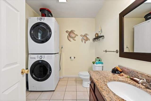 39 Doyle Ave, Dracut, MA 01826 - full bathroom featuring stacked washing machine and dryer, tile patterned flooring, and vanity