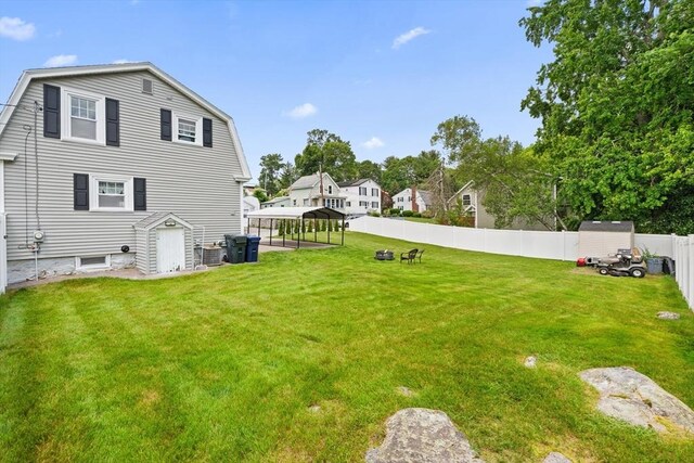 39 Doyle Ave, Dracut, MA 01826 - fenced backyard featuring a storage shed