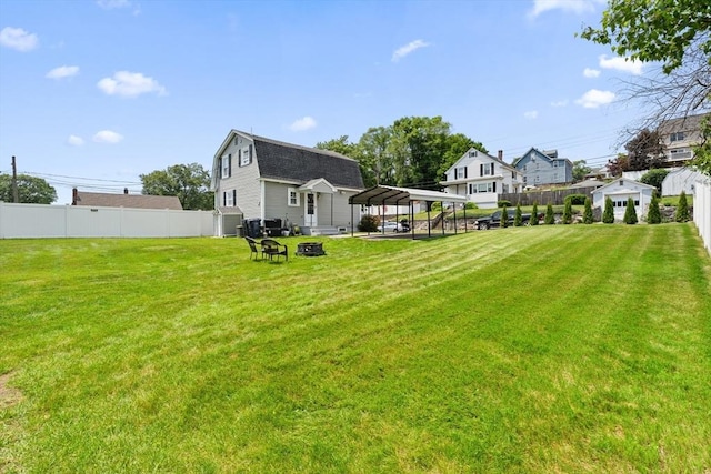 39 Doyle Ave, Dracut, MA 01826 - view of yard with a carport and an outdoor fire pit