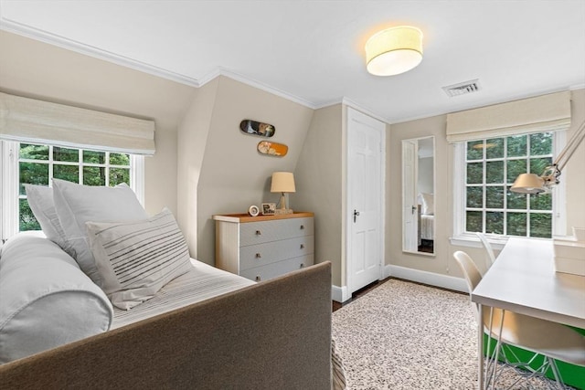 bedroom with ornamental molding, wood finished floors, visible vents, and baseboards