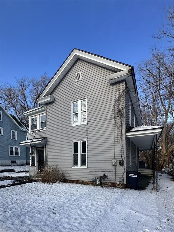 view of snow covered property