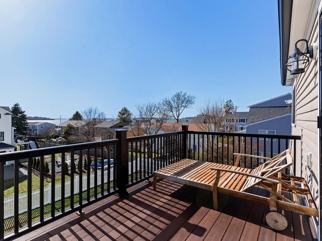 wooden terrace featuring a residential view