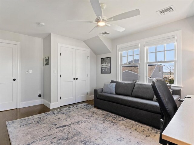 office with baseboards, ceiling fan, dark wood finished floors, and visible vents