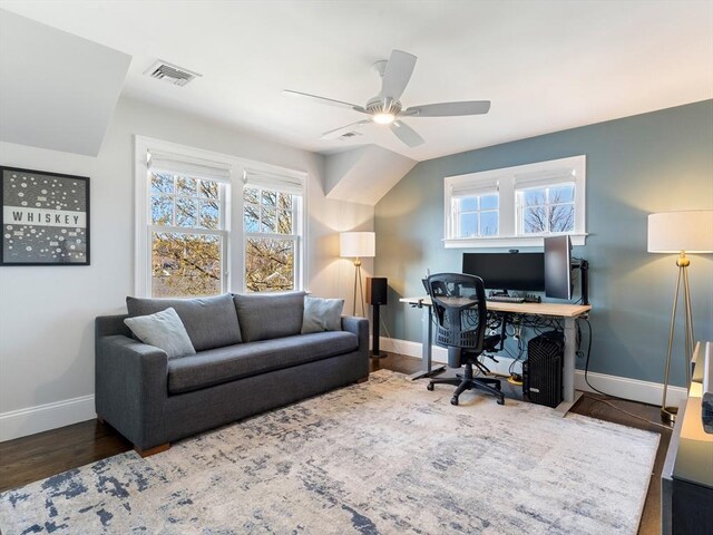 home office with baseboards, a ceiling fan, wood finished floors, and visible vents