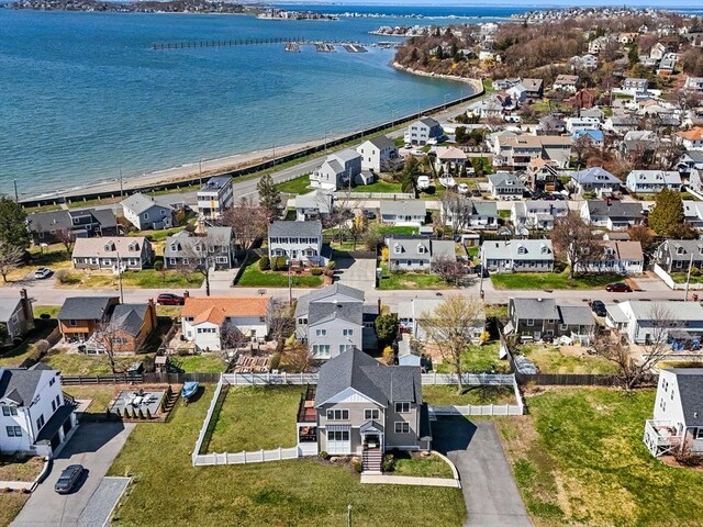 aerial view with a residential view and a water view