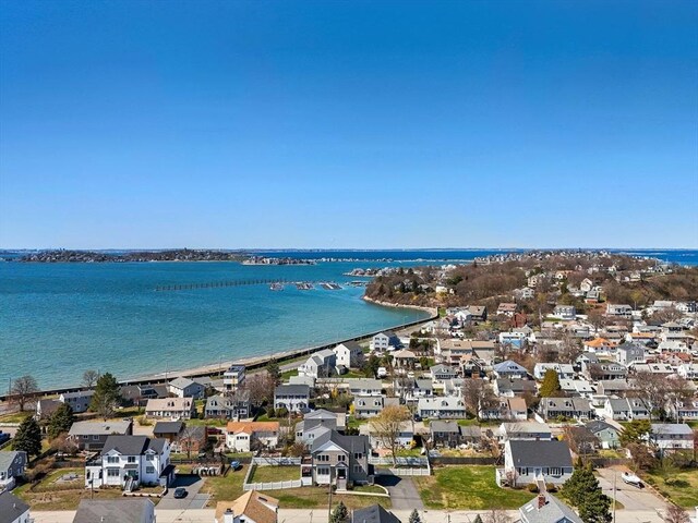 birds eye view of property with a water view and a residential view