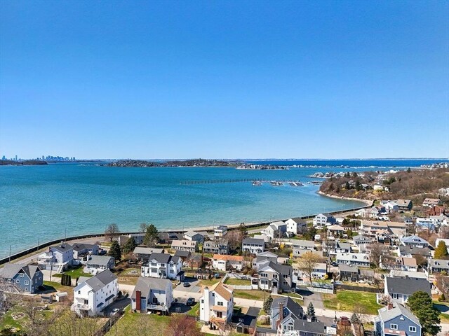 birds eye view of property with a residential view and a water view