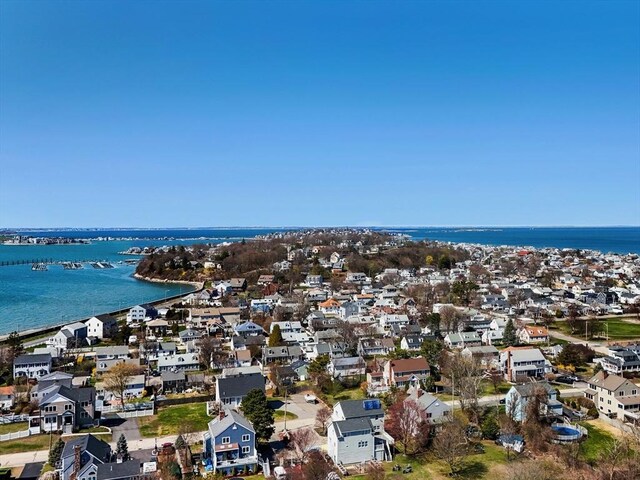 birds eye view of property featuring a water view and a residential view