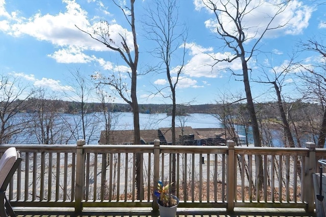 wooden deck featuring a water view