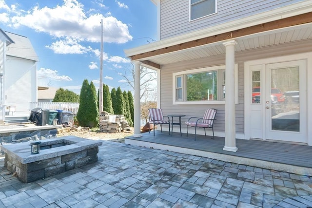 view of patio / terrace with fence and an outdoor hot tub