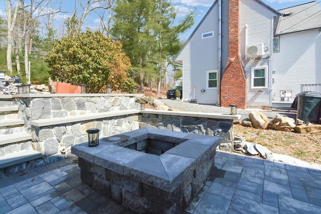 view of patio / terrace with a fire pit