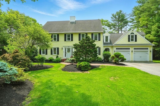 105 Old Barn Path, Marshfield, MA 02050 - colonial inspired home with asphalt driveway, a front lawn, a chimney, and a garage