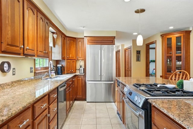 105 Old Barn Path, Marshfield, MA 02050 - kitchen with appliances with stainless steel finishes, a sink, brown cabinets, light stone countertops, and recessed lighting