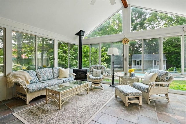 105 Old Barn Path, Marshfield, MA 02050 - sunroom featuring a wood stove, healthy amount of natural light, high vaulted ceiling, beam ceiling, and stone tile flooring
