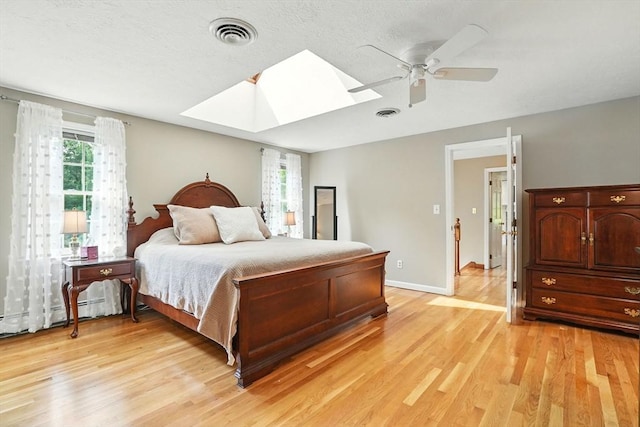 105 Old Barn Path, Marshfield, MA 02050 - bedroom featuring a skylight, multiple windows, and light wood-style floors