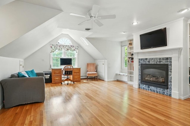 105 Old Barn Path, Marshfield, MA 02050 - living area featuring light wood-style floors, lofted ceiling, ceiling fan, a tiled fireplace, and an office area