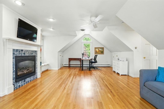 105 Old Barn Path, Marshfield, MA 02050 - living area featuring a ceiling fan, light wood finished floors, a baseboard heating unit, baseboards, and a tile fireplace