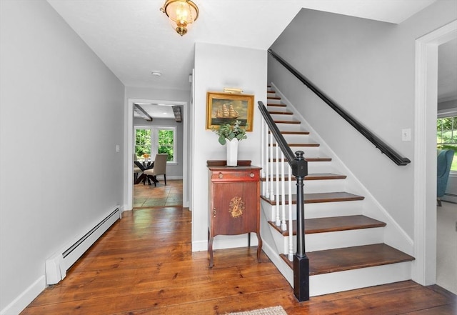 28 Old Farm Rd, Hopkinton, MA 01748 - stairs with a baseboard heating unit, wood-type flooring, and baseboards