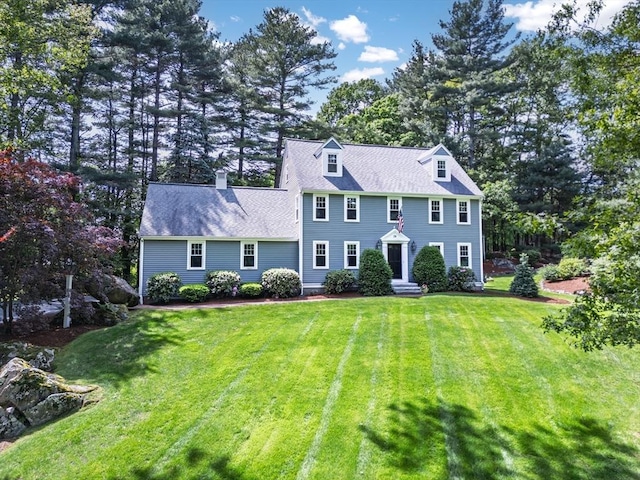 28 Old Farm Rd, Hopkinton, MA 01748 - colonial house with a front lawn and a chimney