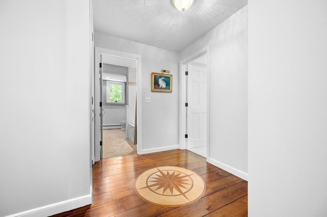 28 Old Farm Rd, Hopkinton, MA 01748 - hall with wood-type flooring, baseboards, and a baseboard radiator