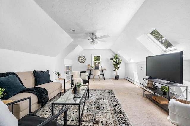 28 Old Farm Rd, Hopkinton, MA 01748 - carpeted living area featuring vaulted ceiling, a skylight, a ceiling fan, and a baseboard radiator
