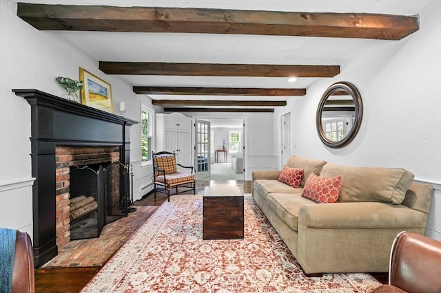 28 Old Farm Rd, Hopkinton, MA 01748 - living area featuring wood finished floors, a fireplace, beam ceiling, and baseboard heating